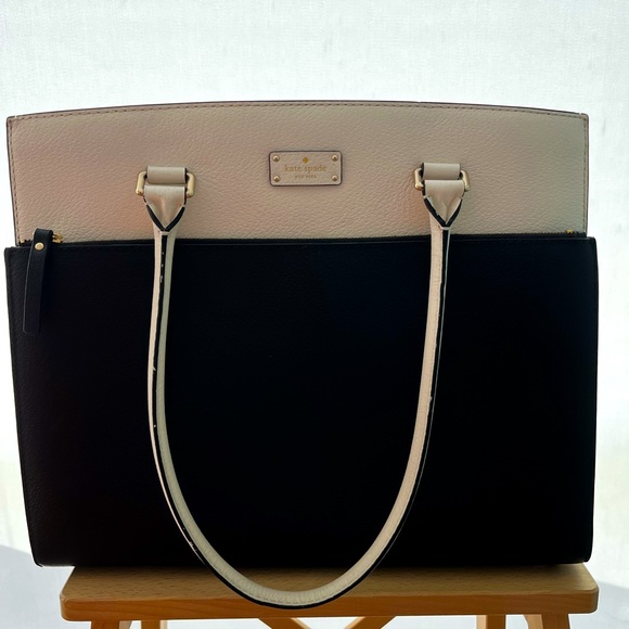 Kate Spade XL tote with front laptop pocket.